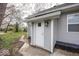 Back entrance to home with door and landscaping at 4325 Crittenden Ave, Indianapolis, IN 46205
