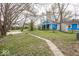 Spacious backyard with mature trees and a large shed at 4325 Crittenden Ave, Indianapolis, IN 46205