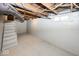 Unfinished basement area with stairs and painted walls at 4325 Crittenden Ave, Indianapolis, IN 46205