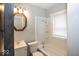 Full bathroom with tub and shower combination and bright vanity lighting at 4325 Crittenden Ave, Indianapolis, IN 46205