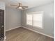 Bedroom with neutral colors, modern fan and two bright windows at 4325 Crittenden Ave, Indianapolis, IN 46205