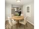 Charming dining area with a round table and views into the modern kitchen at 4325 Crittenden Ave, Indianapolis, IN 46205