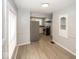 Bright eat-in kitchen with stainless steel refrigerator and adjacent pantry/storage area at 4325 Crittenden Ave, Indianapolis, IN 46205