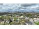An aerial view captures the cityscape nestled among the trees and suburban houses at 433 Jefferson Ave, Indianapolis, IN 46201