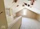 Spacious attic featuring natural light from a window and hardwood floors ready for customization at 4520 Clinton St, Indianapolis, IN 46226