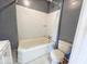 Standard bathroom with a tub/shower combo, toilet, and vanity, ready for updates at 4520 Clinton St, Indianapolis, IN 46226