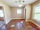 Bright bedroom with ceiling fan, and ready for renovation to suit your style at 4520 Clinton St, Indianapolis, IN 46226