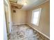 Bedroom with some ceiling damage, window and ready to be renovated at 4520 Clinton St, Indianapolis, IN 46226