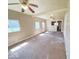 Spacious living room with natural light, ceiling fans, and ready for customization at 4520 Clinton St, Indianapolis, IN 46226