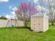 Spacious backyard with a shed, swing set, and flowering tree offers a great outdoor recreational space at 4729 Beach Club Dr, Noblesville, IN 46062
