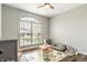 Bright room with a large window, hardwood flooring, neutral paint, and playful decor at 4729 Beach Club Dr, Noblesville, IN 46062