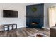 Stylish navy fireplace with wooden mantle, set in a cozy living area at 4729 Beach Club Dr, Noblesville, IN 46062