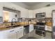 Kitchen featuring stainless steel appliances, granite countertops, and tile backsplash at 4729 Beach Club Dr, Noblesville, IN 46062