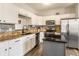 Bright kitchen featuring white cabinets, stainless steel appliances, and granite countertops at 4729 Beach Club Dr, Noblesville, IN 46062