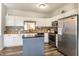 Well-lit kitchen featuring stainless steel appliances, granite countertops, and a central island at 4729 Beach Club Dr, Noblesville, IN 46062