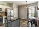 Open concept kitchen and dining area with an island and wood flooring at 4729 Beach Club Dr, Noblesville, IN 46062