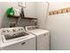 Laundry room equipped with a washer and dryer, with shelf and rack at 4729 Beach Club Dr, Noblesville, IN 46062