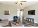 Open floor plan living room features wood floors and view into other areas of the home at 4729 Beach Club Dr, Noblesville, IN 46062