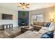 Comfortable living room features wood floors, a fireplace, and large sectional sofa at 4729 Beach Club Dr, Noblesville, IN 46062