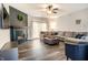 Inviting living room with a fireplace, plush sectional, and wood-look flooring at 4729 Beach Club Dr, Noblesville, IN 46062