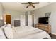 Cozy main bedroom with modern gray walls, a ceiling fan, and warm natural light at 4729 Beach Club Dr, Noblesville, IN 46062