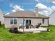Patio with outdoor seating and a grill, perfect for entertaining in the well maintained backyard at 4729 Beach Club Dr, Noblesville, IN 46062