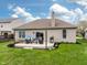 Backyard patio featuring outdoor seating, a grill, and a well-maintained lawn under a clear sky at 4729 Beach Club Dr, Noblesville, IN 46062