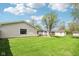 A verdant backyard features a shed and shade trees at 4905 Candy Spots Dr, Indianapolis, IN 46237