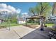 A serene backyard featuring a concrete patio with a gazebo and a lush, green lawn at 4905 Candy Spots Dr, Indianapolis, IN 46237