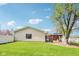 An ample backyard featuring a shade tree and concrete patio at 4905 Candy Spots Dr, Indianapolis, IN 46237