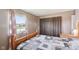 Cozy bedroom featuring a window, curtains, and a comfortable bed with stylish quilt at 4905 Candy Spots Dr, Indianapolis, IN 46237