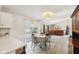Well-lit dining area flowing into the open living room, perfect for entertaining at 4905 Candy Spots Dr, Indianapolis, IN 46237