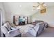 Open living area with vaulted ceiling, a ceiling fan and large windows for natural light at 4905 Candy Spots Dr, Indianapolis, IN 46237