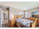 Comfortable main bedroom with doorway, neutral walls, a bed, and coordinated decor at 4905 Candy Spots Dr, Indianapolis, IN 46237
