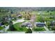 Aerial view of a home with a well-maintained lawn, mature trees, and a circular driveway at 4977 Beechwood Rd, Avon, IN 46123