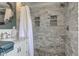 Bathroom featuring a shower with marble tile and a vanity with marble countertop at 4977 Beechwood Rd, Avon, IN 46123