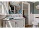Bathroom with white vanity, marble countertop, and an ornate mirror at 4977 Beechwood Rd, Avon, IN 46123