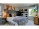 Bedroom with decorative marquee letters, a workstation, and large window at 4977 Beechwood Rd, Avon, IN 46123