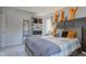 Comfortable bedroom featuring stylish decor, closet, ladder, and a window for natural light at 4977 Beechwood Rd, Avon, IN 46123
