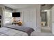 Bright bedroom with large window, TV, and double closet doors at 4977 Beechwood Rd, Avon, IN 46123