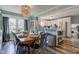 Spacious dining area with a wooden table, stylish metal chairs, and an open view to the kitchen at 4977 Beechwood Rd, Avon, IN 46123