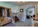 Home foyer featuring a wooden coat rack and bench, open view to the living room, and a staircase to the second floor at 4977 Beechwood Rd, Avon, IN 46123