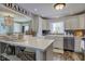 Bright kitchen with white cabinets, stainless steel appliances, and a breakfast bar at 4977 Beechwood Rd, Avon, IN 46123