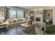 Inviting living room with a fireplace, comfortable seating, and large windows for ample natural light at 4977 Beechwood Rd, Avon, IN 46123