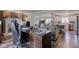 Home office with a desk and an open view to the dining room, living room and kitchen at 4977 Beechwood Rd, Avon, IN 46123