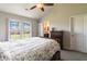 Charming bedroom with a queen-sized bed, a window, and a chest of drawers, offering a cozy and functional living space at 5007 Avian Ln, Indianapolis, IN 46235