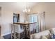Stylish dining area with a modern table, comfortable chairs, and sliding door access at 5007 Avian Ln, Indianapolis, IN 46235
