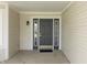 Charming front door with sidelights and a modern black finish at 5007 Avian Ln, Indianapolis, IN 46235