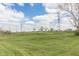 Scenic view of community green space with well-maintained lawn and open sky at 5007 Avian Ln, Indianapolis, IN 46235