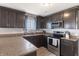 Well-appointed kitchen with stainless steel appliances, granite countertops, and plenty of storage, ideal for culinary enthusiasts at 5007 Avian Ln, Indianapolis, IN 46235